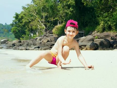 Kid on the beach Stock Photos