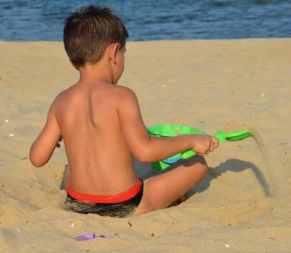 Kid on the beach Stock Photos