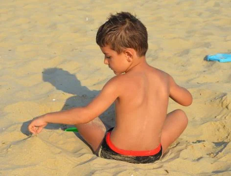 Kid on the beach Stock Photos