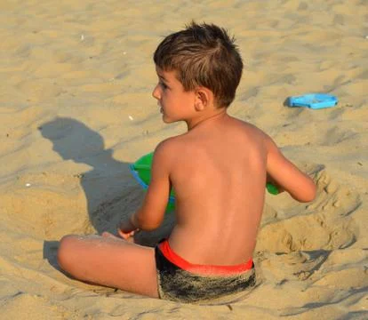 Kid on the beach Stock Photos