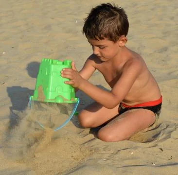 Kid on the beach Stock Photos