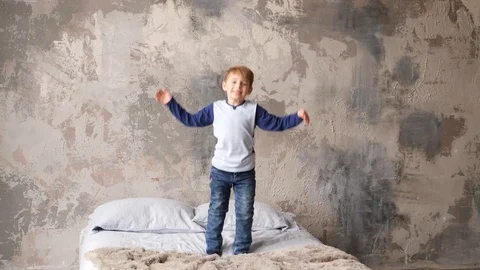Kid on a bed Video stock 89471851
