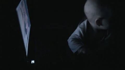 The kid behind the laptop in the dark Stock-Footage 85532151