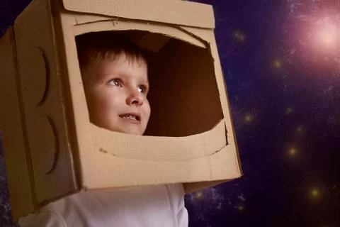 A kid with a box on his head Stock Photos