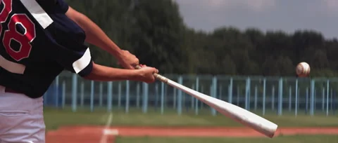 Kid boy batter baseball player hits a ball over a home plate. Super slow motion Vidéo 157932442