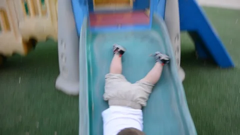 Kid boy having fun to play on children toy playground Vidéo 112230668