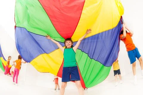 Kid boy standing under tent made of parachute 스톡 사진
