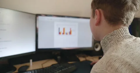 Kid Boy Use Desktop Computer for Study Typing and Reading. 4K 10-bit Stock Footage 336672805