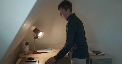 Kid Boy Wipe Desk with Wet Sponge Cleaning Table in Room. 4K 10-bit Stock Footage 337626454