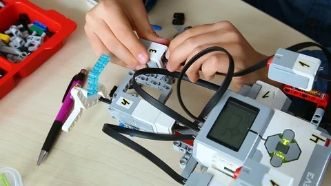Kid building computerized robot at robotics lesson. Editorial use only Video stock 87040809