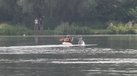 Kid with canoe on lake Video stock 30364906