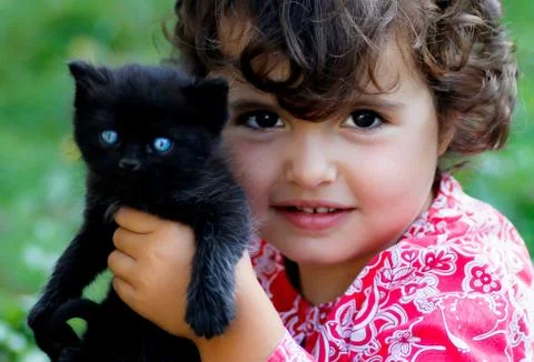 Kid with cat Stock Photos