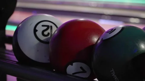 Kid chosing size bowling ball for children Stock Footage 285435727