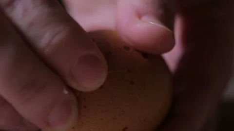 Kid cleans separates egg Stock Footage 58600374