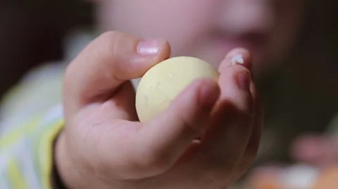 Kid cleans separates egg Stock Footage 58600677