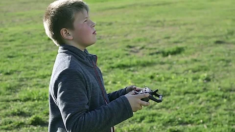 Kid controls the drone Stock Footage 75659117