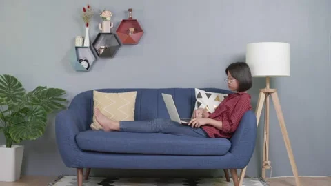 Kid on couch using laptop notebook Stock-Footage 155161674