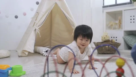 Kid is crawling from the tent to play Stock Footage 154445667