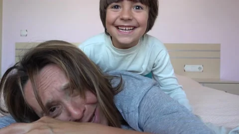 Kid creeps and attacks his sleeping mother Stock Footage 131360704