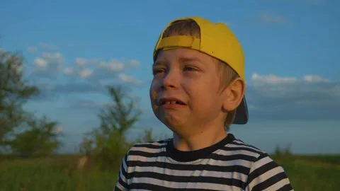 Kid is crying. close-up of a child face in tears. Domestic violence concept. Kid Stock-Footage 144484307