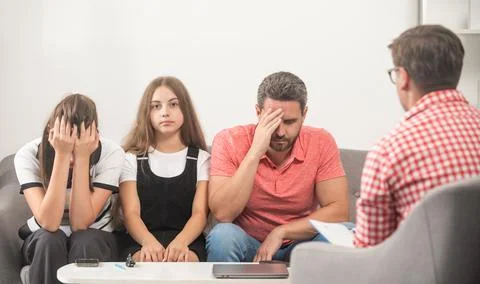 Kid with daddy sitting at psychologist solving problem, psychology Stock Photos