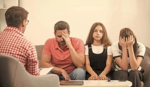 Kid with daddy sitting at psychologist solving problem, psychology Stock Photos