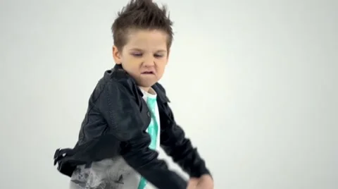 Kid dances as a rock star in slow motion Stock Footage 58935145