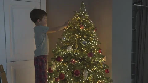 Kid Decorating Christmas Tree Close Up Hands Hanging Ball Ornament Festive Stock Footage 344881818