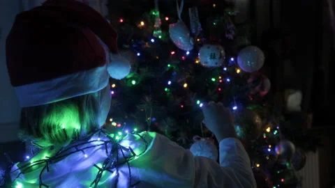 Kid decorating Christmas tree. Stock Footage 219318134