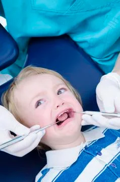 Kid at dentist Stock Photos