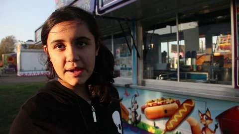Kid at deserted fair talking to camera Stock Footage 154940985