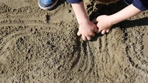Kid digging sand with both hands Stock Footage 88597921