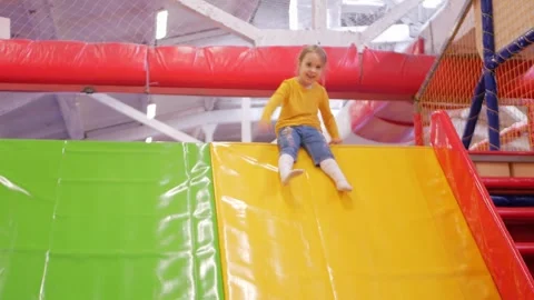 Kid discovers endless fun at bustling entertainment center destination. Video stock 269919750