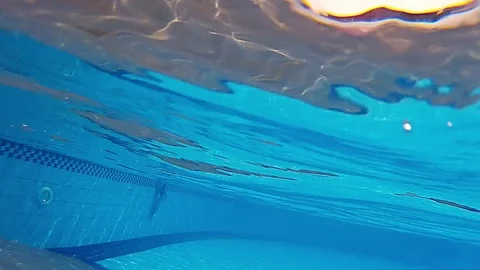 Kid dives into a pool Stock Footage 75452771