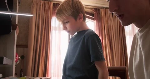 Kid doing homework Stock Footage 165827855