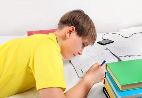 Kid doing Homework Stock Photos