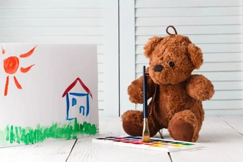 Kid draw learning, teddy with paints Stock Photos