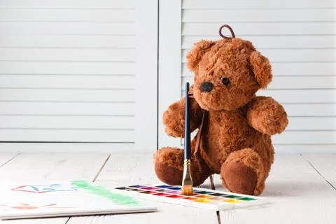 Kid draw learning, teddy with paints Stock Photos