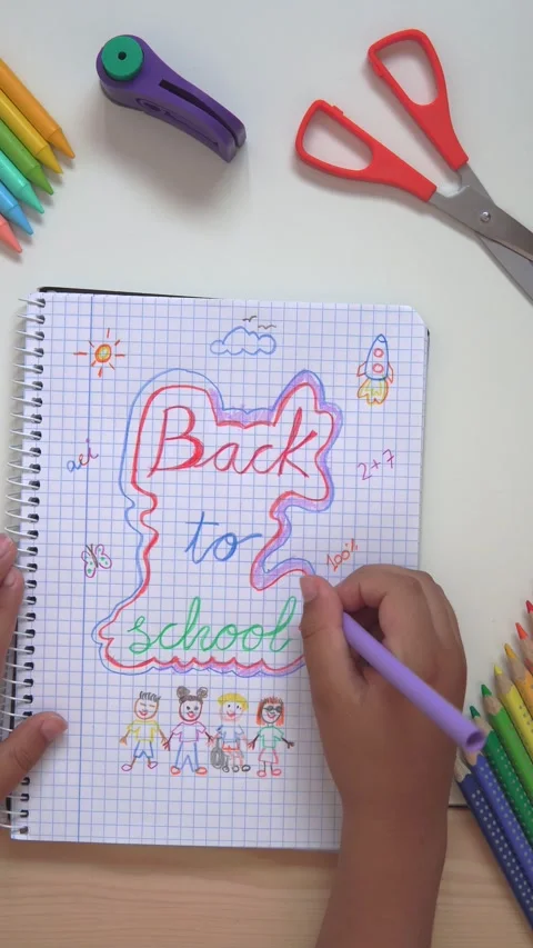 Kid drawing back to school on a notebook Stock Footage 279337755