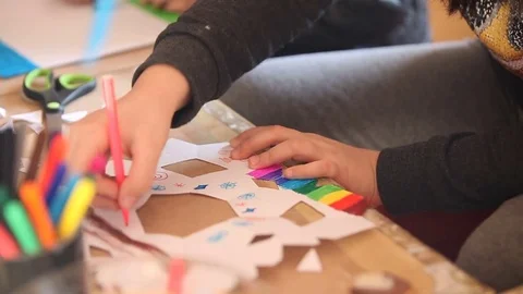 Kid drawing on paper cuts Stock Footage 73018450