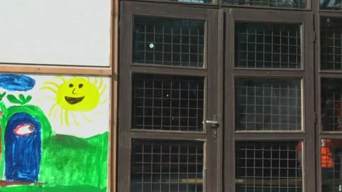Kid drawings on a building wall Stock Footage 132641730