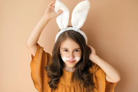 Kid dressed up as a rabbit with a painted face Stock Photos