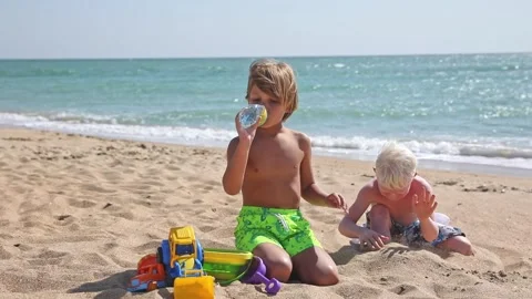 Kid drinking fresh water from a bottle. Vacation concept.  Stock Footage 265870096