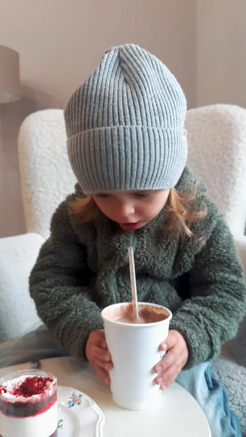 Kid Drinking Hot Chocolate with Cake Indoor Close Up 스톡 동영상 332656775