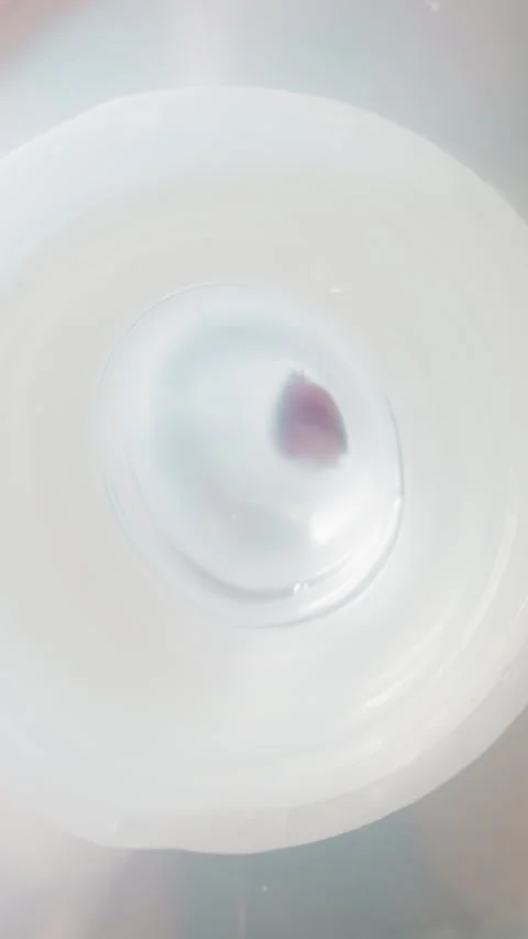 Kid drinks water using white nipple and puts bottle on table Stock Footage 307461425