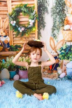 Kid on Easter egg hunt. Easter holidays Stock Photos