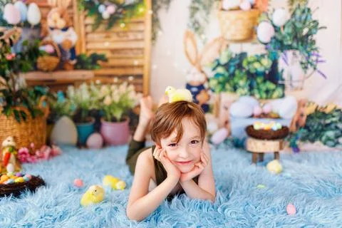 Kid on Easter egg hunt. Easter holidays Stock Photos