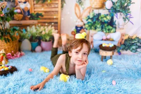 Kid on Easter egg hunt. Easter holidays Stock Photos