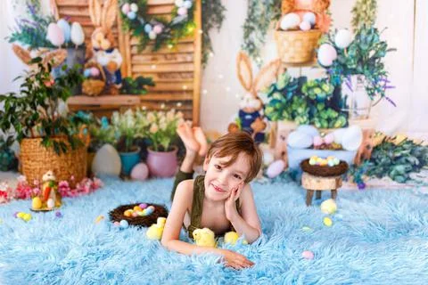 Kid on Easter egg hunt. Easter holidays Stock Photos
