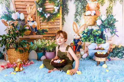 Kid on Easter egg hunt. Easter holidays Stock Photos